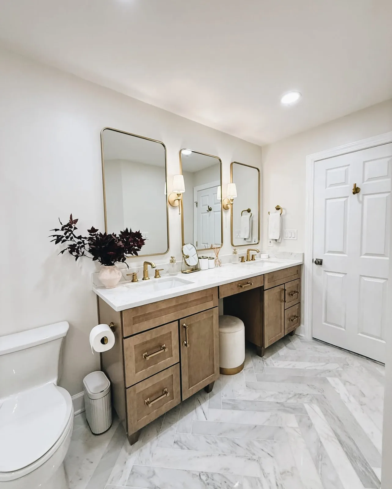 Bathroom remodel with a double vanity and marble tile